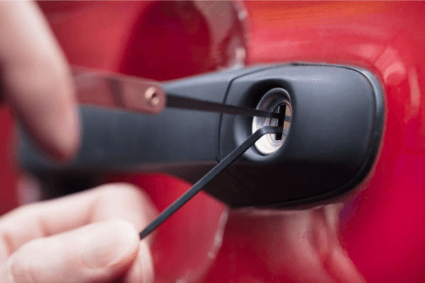 Locksmith working on a car door for a lockout service